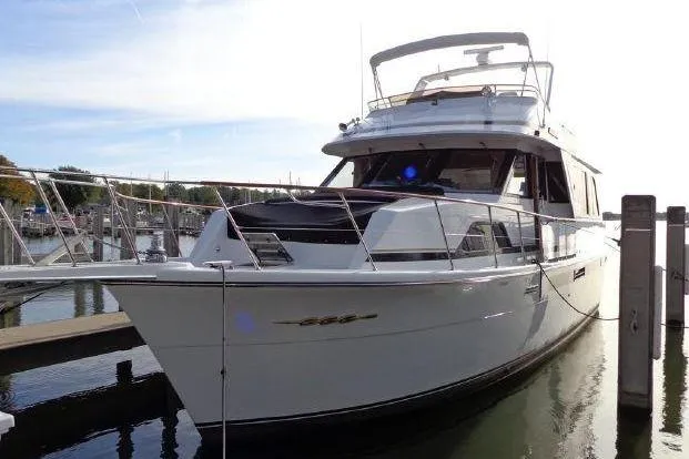Slide: The Image of 1988 Chris-Craft 501 Motor Yacht docked at a marina, side view. - 3