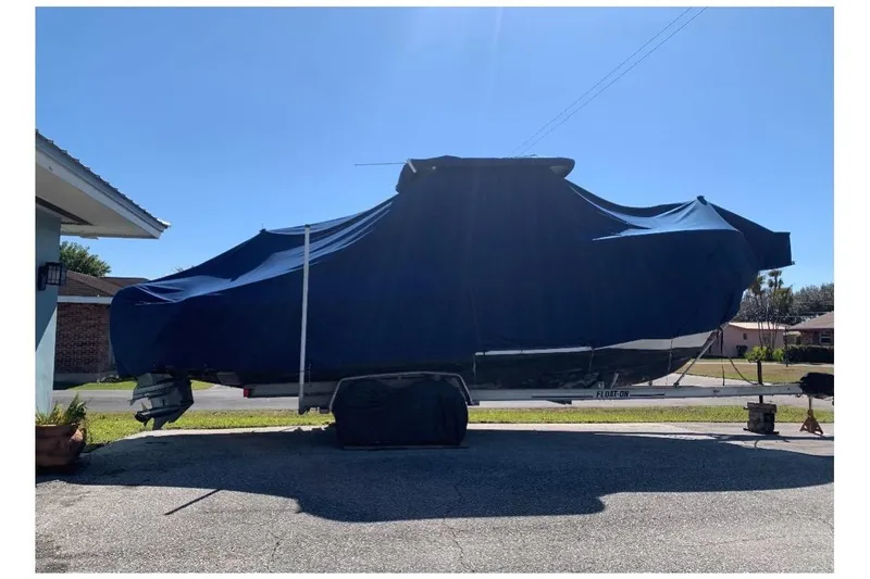 The Image of 1994 Grady-White Sailfish 272 boat covered on trailer. - 0