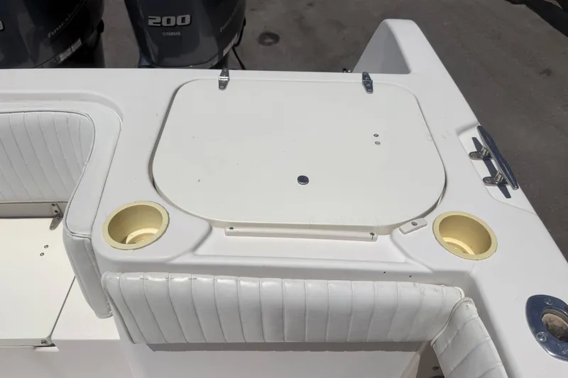 Slide: The Image of 1994 Grady-White Sailfish 272 boat deck with seating and storage compartments. - 100
