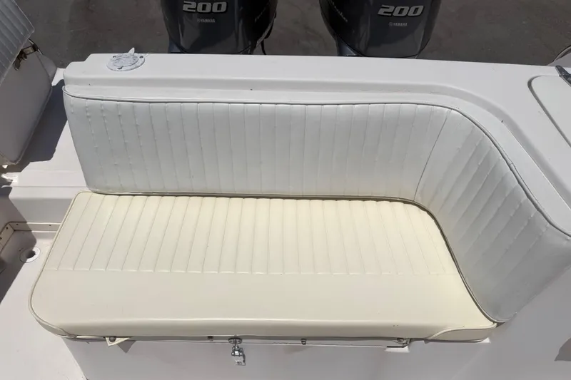 Slide: The Image of White cushioned seating on a 1994 Grady-White Sailfish 272 boat with Yamaha engines. - 102