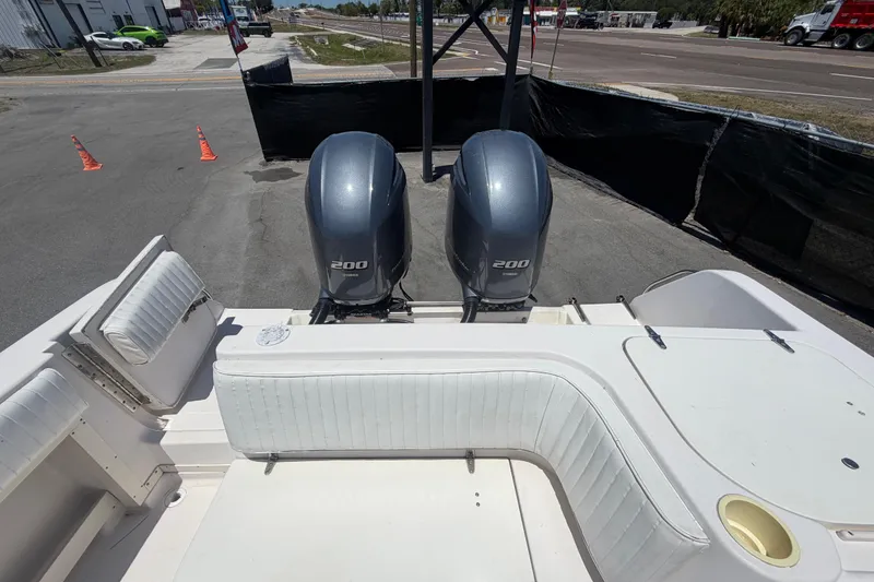 Slide: The Image of 1994 Grady-White Sailfish 272 boat with twin Yamaha 200 engines, docked on pavement. - 107