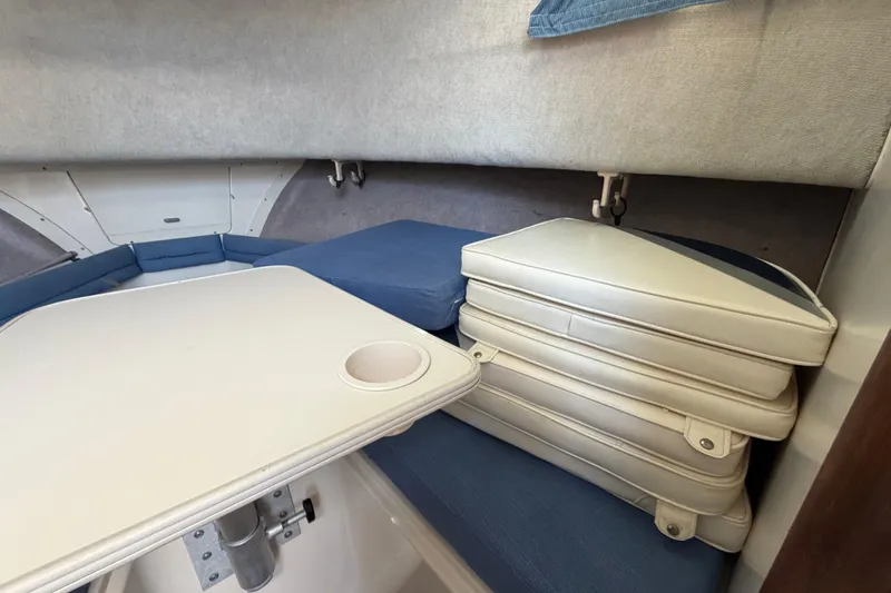 Slide: The Image of Interior cabin of 1994 Grady-White Sailfish 272 with cushions and table. - 109