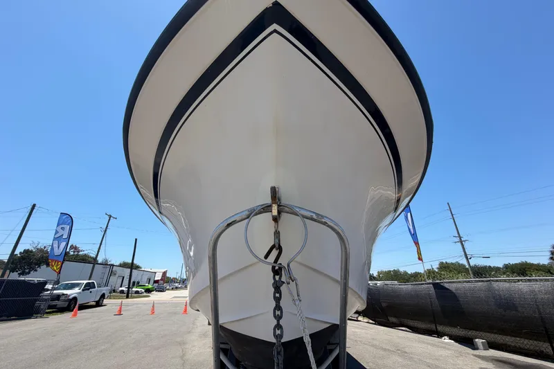 Slide: The Image of 1994 Grady-White Sailfish 272 boat front view under clear blue sky. - 11