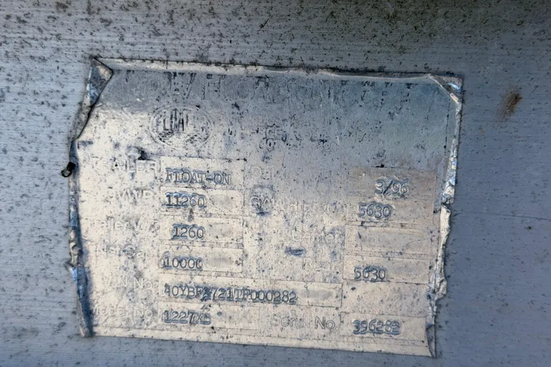 Slide: The Image of 1994 Grady-White Sailfish 272 identification plate with specifications and serial numbers. - 113