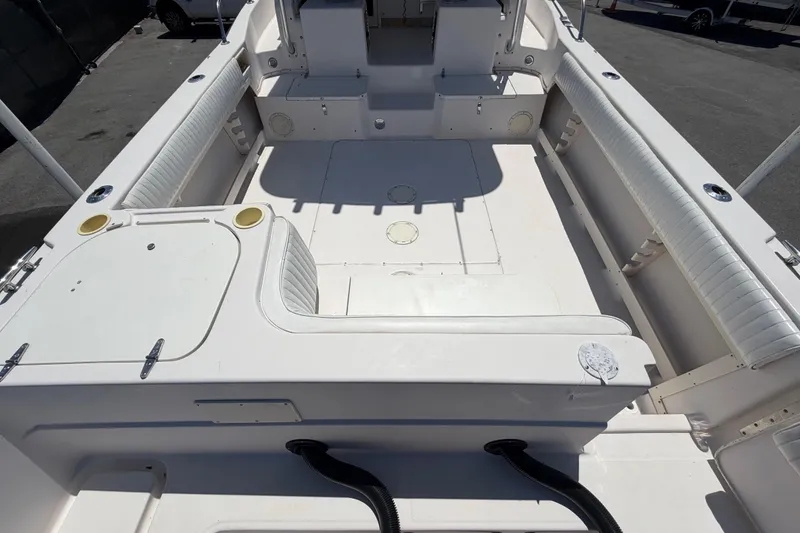 Slide: The Image of 1994 Grady-White Sailfish 272 boat interior, featuring spacious seating and clean deck layout. - 13