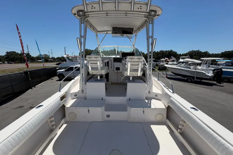 Slide: The Image of 1994 Grady-White Sailfish 272 boat interior with dual helm seats and spacious deck. - 16