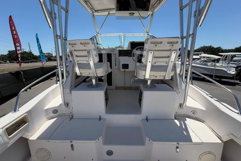 Slide: The Image of 1994 Grady-White Sailfish 272 boat interior with dual captain chairs and control console. - 17