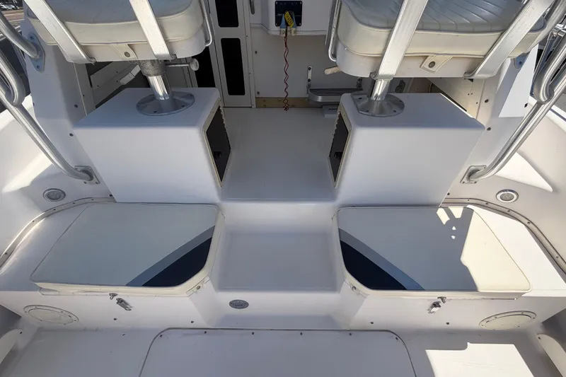 Slide: The Image of 1994 Grady-White Sailfish 272 boat interior with seating and storage compartments. - 18