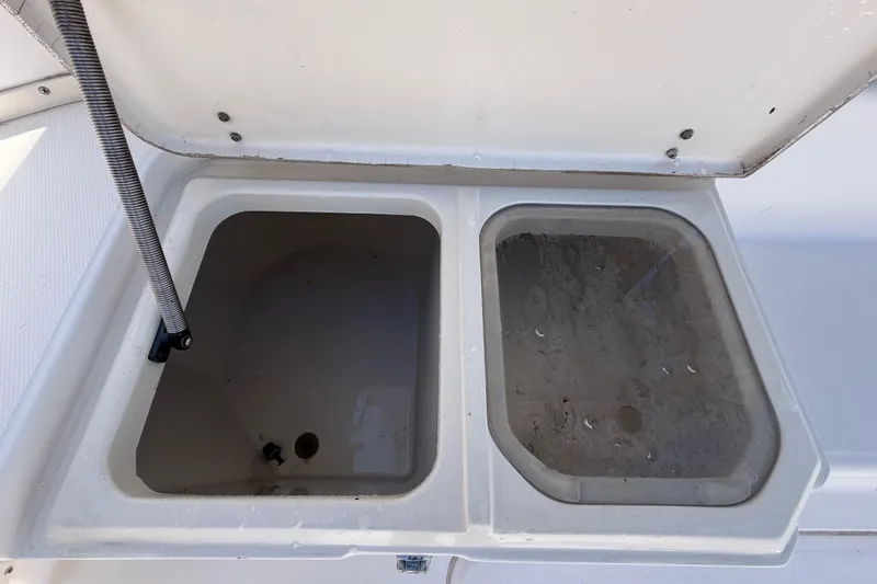 Slide: The Image of Open storage compartments on a 1994 Grady-White Sailfish 272 boat. - 20
