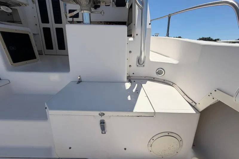 Slide: The Image of 1994 Grady-White Sailfish 272 boat interior with seating and storage compartments. - 22