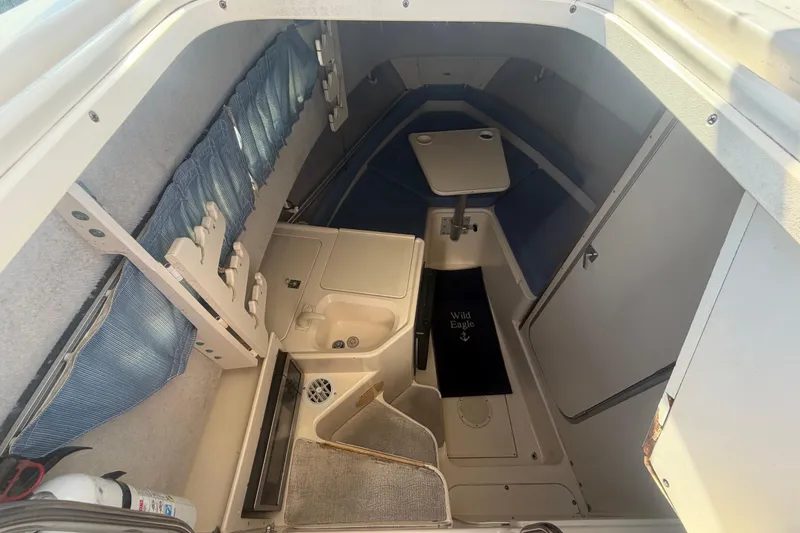 Slide: The Image of Interior cabin of 1994 Grady-White Sailfish 272 boat with seating and table. - 39