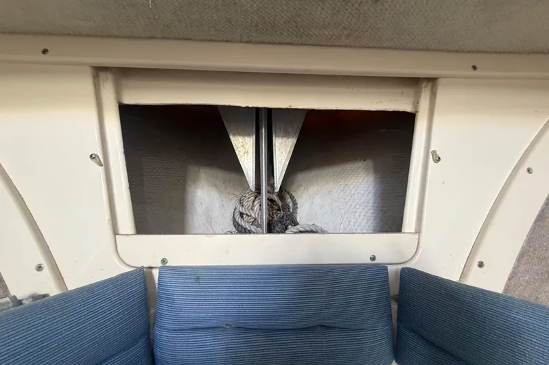 Slide: The Image of Interior view of a 1994 Grady-White Sailfish 272 boat, featuring a storage compartment. - 47