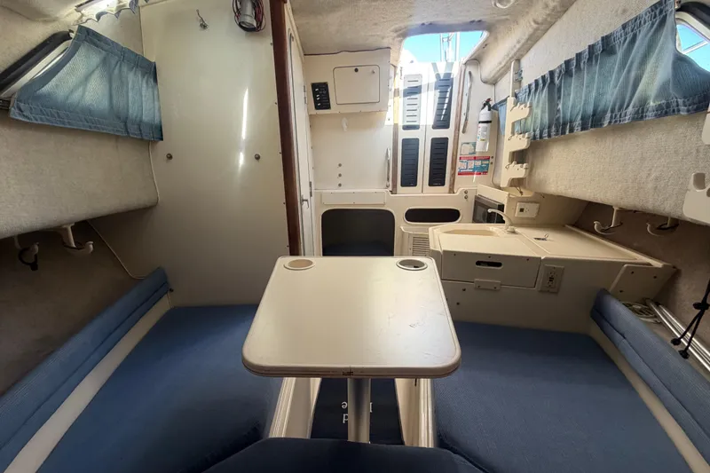 Slide: The Image of Interior of 1994 Grady-White Sailfish 272 boat with seating and table. - 50