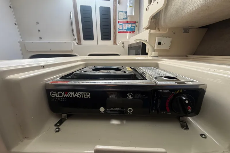 Slide: The Image of Glowmaster GM1000 stove inside 1994 Grady-White Sailfish 272 boat cabin. - 57