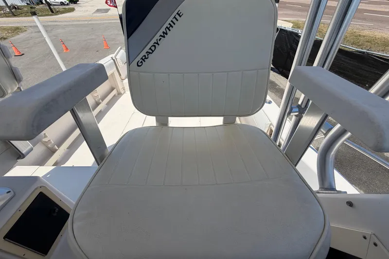 Slide: The Image of Grady-White Sailfish 272 boat seat, 1994 model, with white upholstery and armrests. - 74