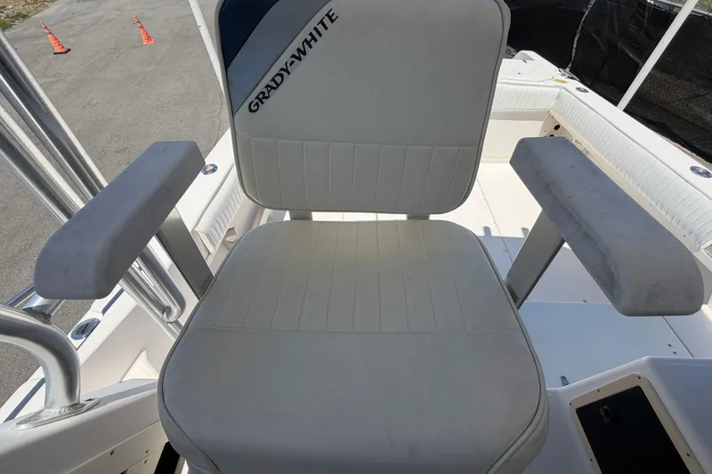 Slide: The Image of Grady-White Sailfish 272 boat seat, 1994 model, with armrests and branded upholstery. - 77