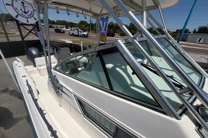 Slide: The Image of 1994 Grady-White Sailfish 272 boat with sleek design and sturdy frame, docked outdoors. - 95