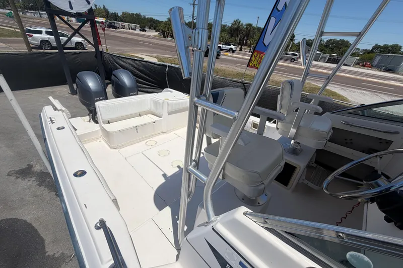 Slide: The Image of 1994 Grady-White Sailfish 272 boat interior with dual engines and seating. - 97
