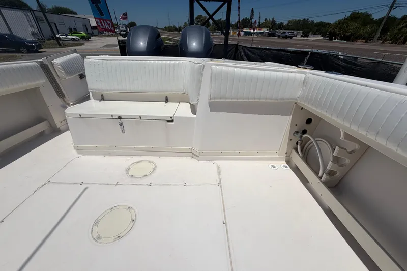 Slide: The Image of 1994 Grady-White Sailfish 272 boat interior with seating and storage compartments. - 99