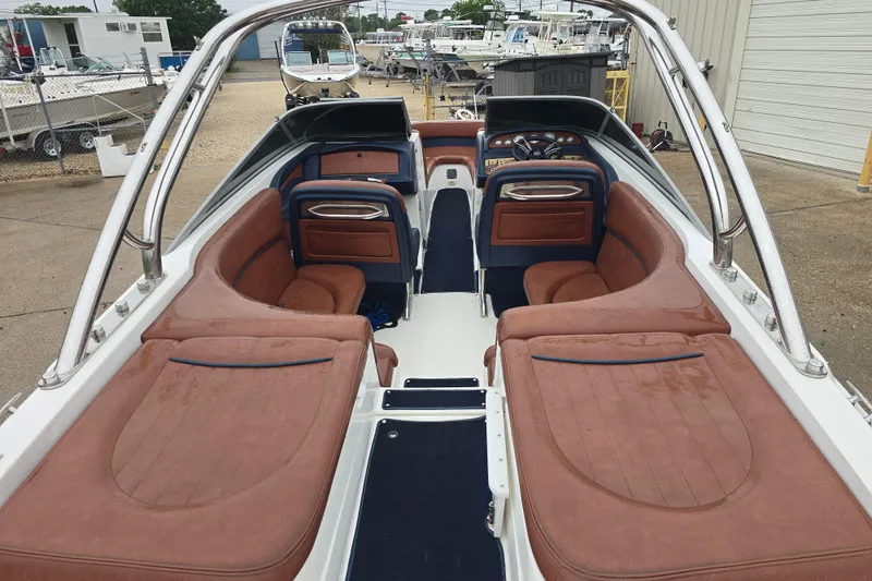 Slide: The Image of Interior view of a 2003 Cobalt 262 boat with brown seating and sleek design. - 14