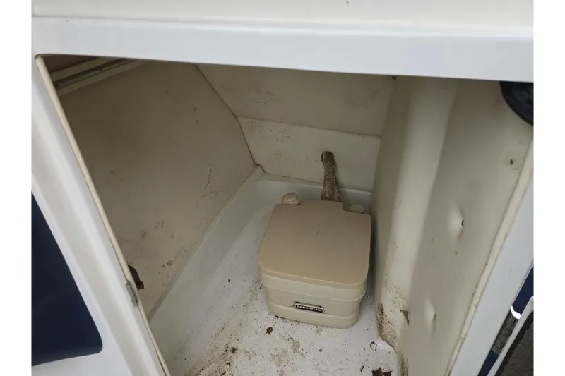 Slide: The Image of Storage compartment with portable toilet in 2003 Cobalt 262 boat. - 16