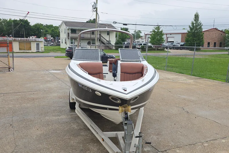 Slide: The Image of 2003 Cobalt 262 boat on trailer in a parking lot. - 4