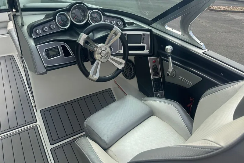 Slide: The Image of 2017 MasterCraft X26 boat interior with steering wheel and dashboard controls. - 5