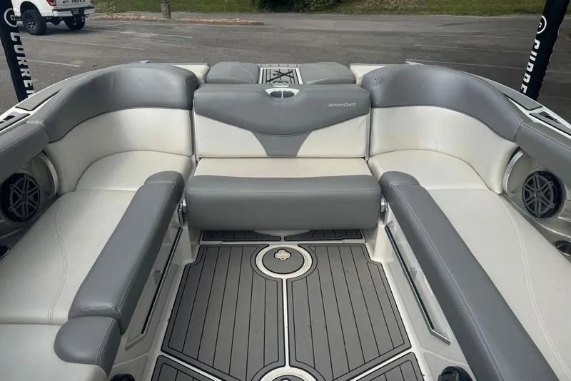 Slide: The Image of 2017 MasterCraft X26 boat interior with gray and white seating. - 7