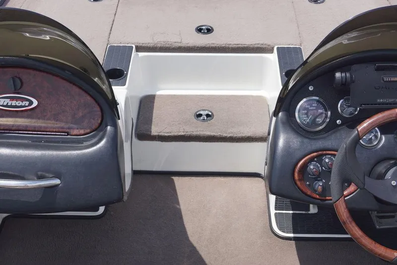 Slide: The Image of 2004 Triton Tr-196 DC boat dashboard with steering wheel and instrument panel. - 14