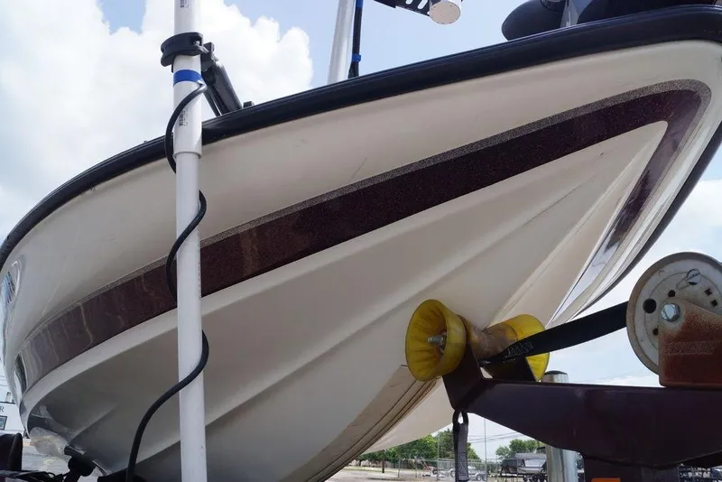 Slide: The Image of 2004 Triton Tr-196 DC boat on trailer, viewed from below, showcasing hull design. - 3