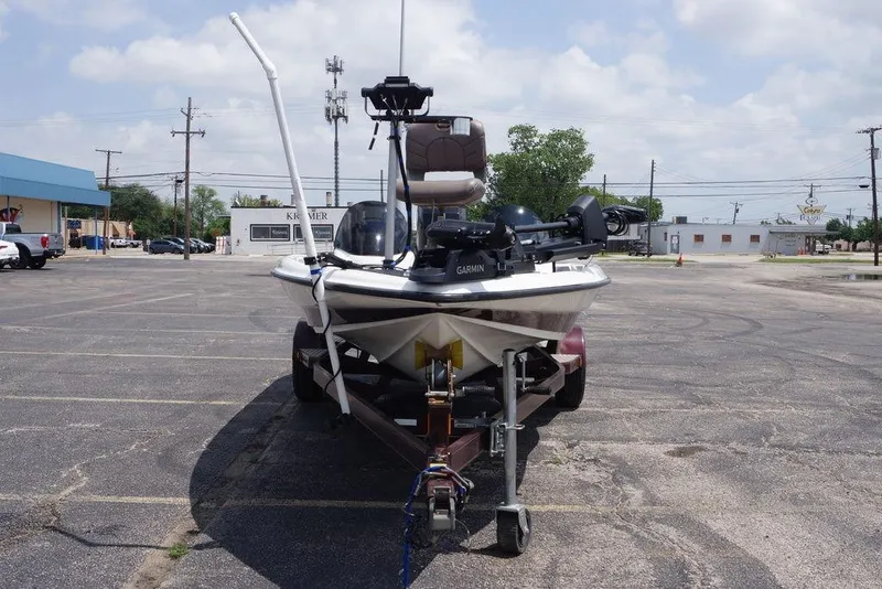 Slide: The Image of 2004 Triton Tr-196 DC boat on trailer in parking lot, equipped with Garmin technology. - 6