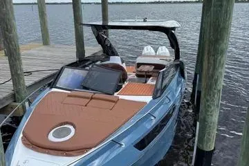 The Image of 2025 NX Boats NX290 Exclusive docked, showcasing sleek design and luxurious features. - 1