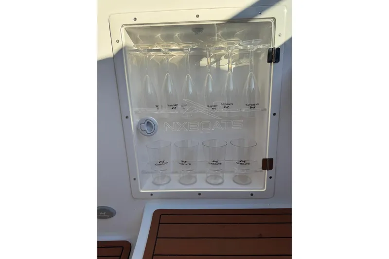 Slide: The Image of Built-in glass holder on NX Boats NX290 Exclusive, 2025 model. - 13