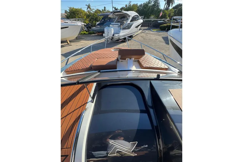 Slide: The Image of 2025 NX Boats NX290 Exclusive with sleek deck design and luxurious seating. - 17