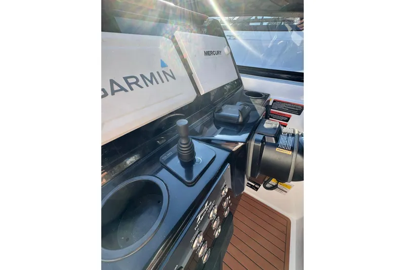 Slide: The Image of Control panel of 2025 NX Boats NX290 Exclusive with Garmin and Mercury displays. - 22