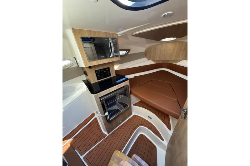 Slide: The Image of Luxurious interior of 2025 NX Boats NX290 Exclusive with modern amenities and elegant design. - 27