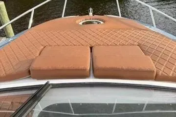 Slide: The Image of 2025 NX Boats NX290 Exclusive deck with cushioned seating and quilted design. - 8
