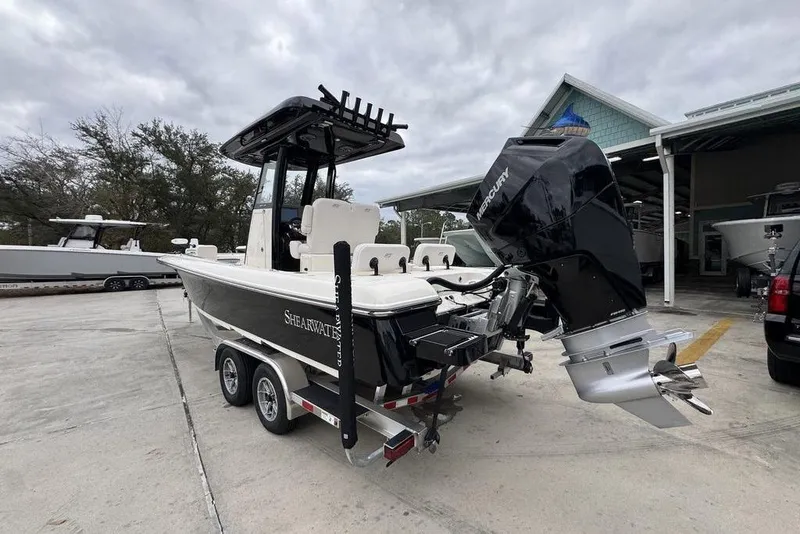 Slide: The Image of 2026 ShearWater 260 Carolina Flare boat on trailer with Mercury outboard motor. - 15