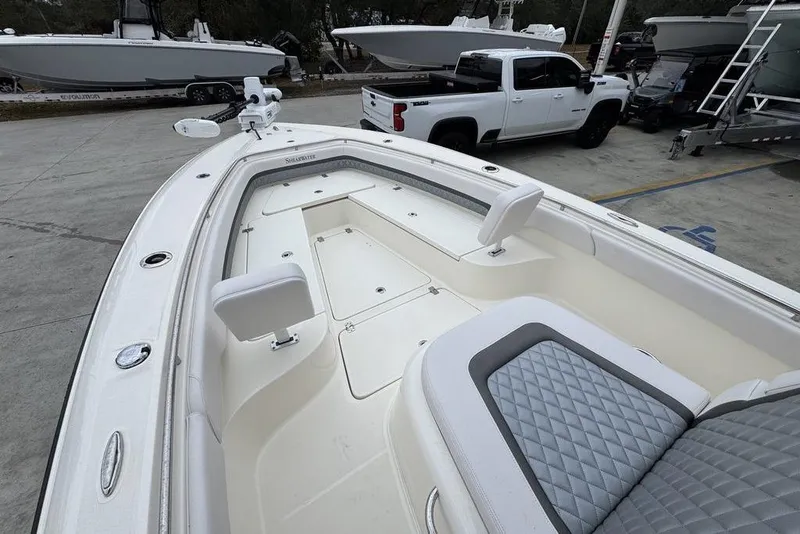 Slide: The Image of 2026 ShearWater 260 Carolina Flare boat with spacious seating and sleek design. - 19