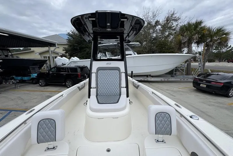 Slide: The Image of 2026 ShearWater 260 Carolina Flare boat with sleek design and comfortable seating. - 23
