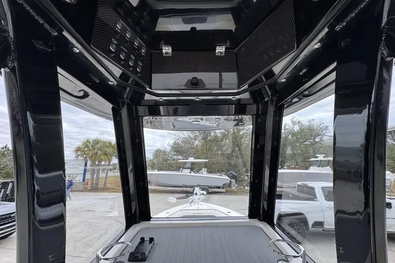 Slide: The Image of Interior view of 2026 ShearWater 260 Carolina Flare boat, showcasing sleek design and controls. - 31