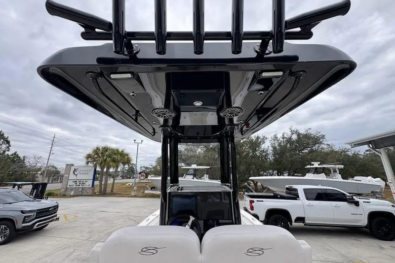 Slide: The Image of 2026 ShearWater 260 Carolina Flare boat with sleek black T-top design. - 36