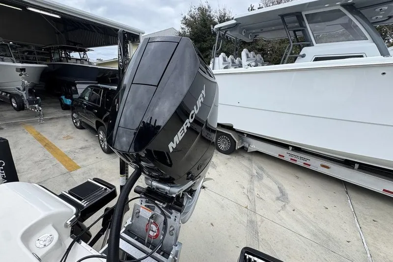 Slide: The Image of 2026 ShearWater 260 Carolina Flare boat with Mercury outboard motor on trailer. - 39