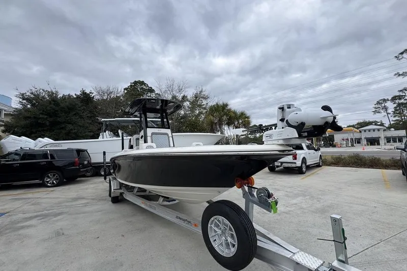 Slide: The Image of 2026 ShearWater 260 Carolina Flare boat on trailer in parking lot. - 6