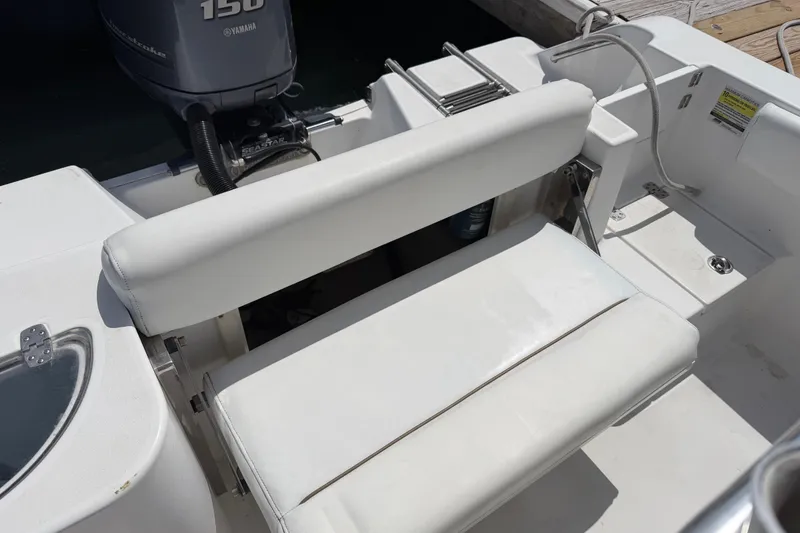 Slide: The Image of 2015 Sportsman Open 212 Center Console boat interior with Yamaha engine. - 12