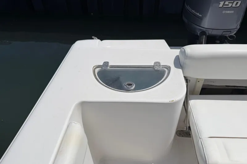 Slide: The Image of 2015 Sportsman Open 212 Center Console boat with Yamaha 150 engine, featuring a livewell. - 13