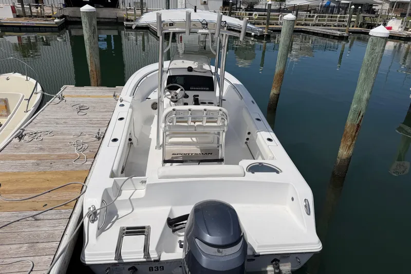 Slide: The Image of 2015 Sportsman Open 212 Center Console boat docked at marina. - 3