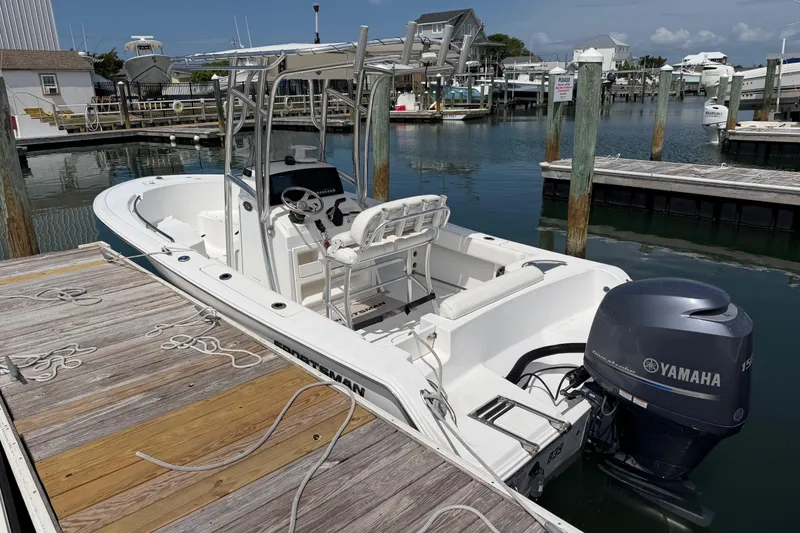Slide: The Image of 2015 Sportsman Open 212 Center Console boat docked with Yamaha engine. - 6
