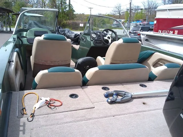 Slide: The Image of Interior of a 2006 Stratos ST486F boat with seats and console. - 3