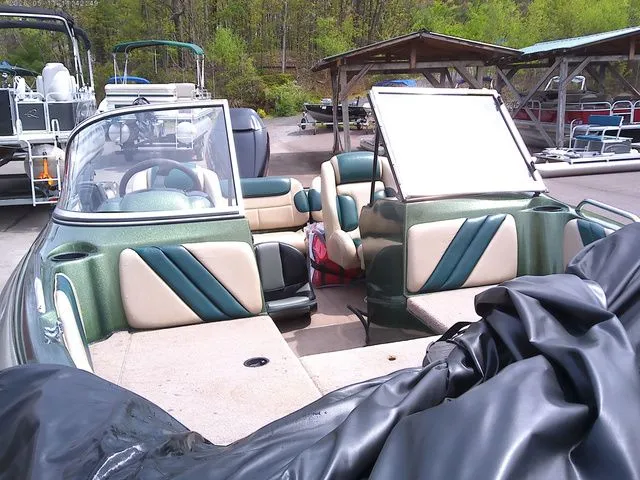 Slide: The Image of Interior view of a 2006 Stratos ST486F boat at the dock. - 6